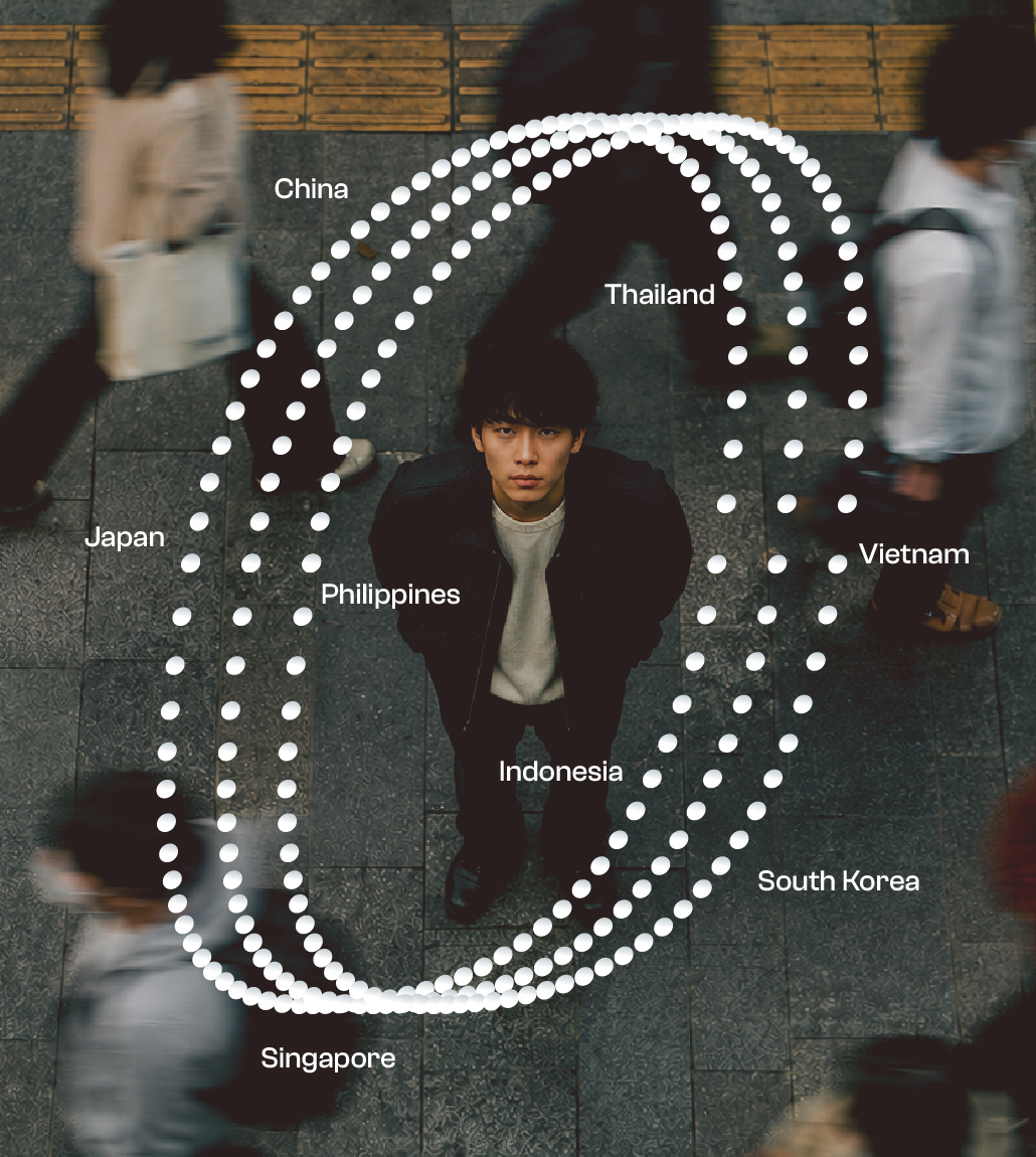 a man looking up at the camera from the street with people walking by overlayed with graphics and text